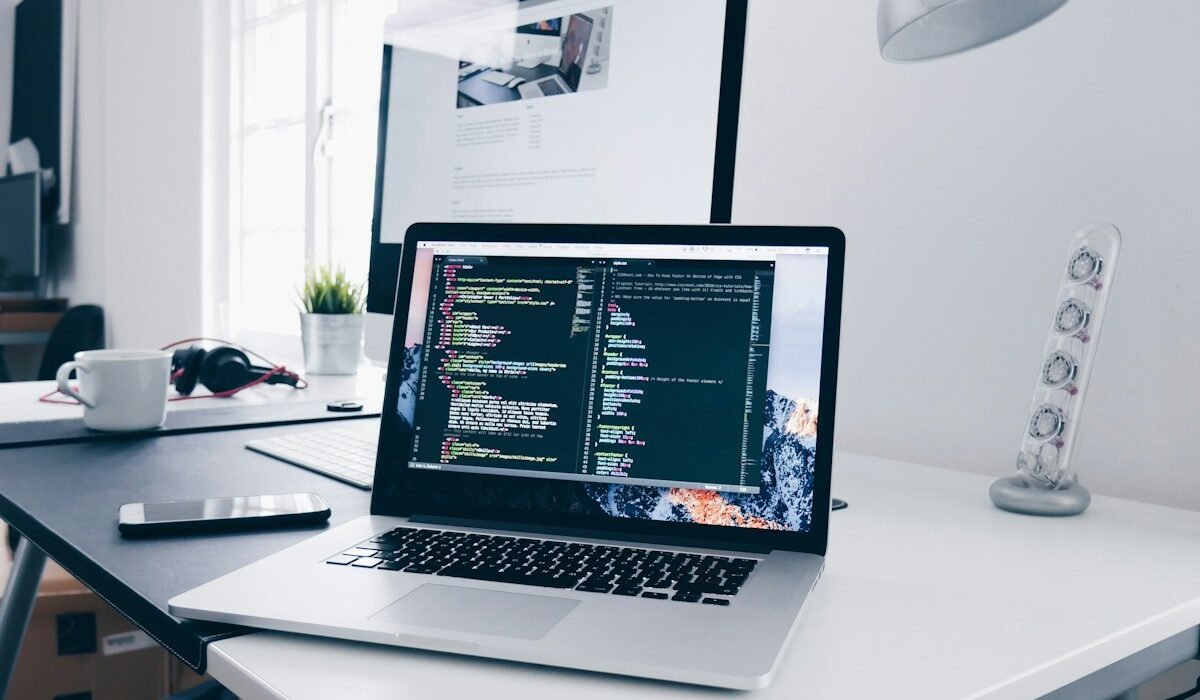 Developer working on a website at a laptop