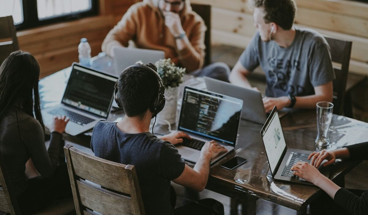 Team discussing a software project at a table